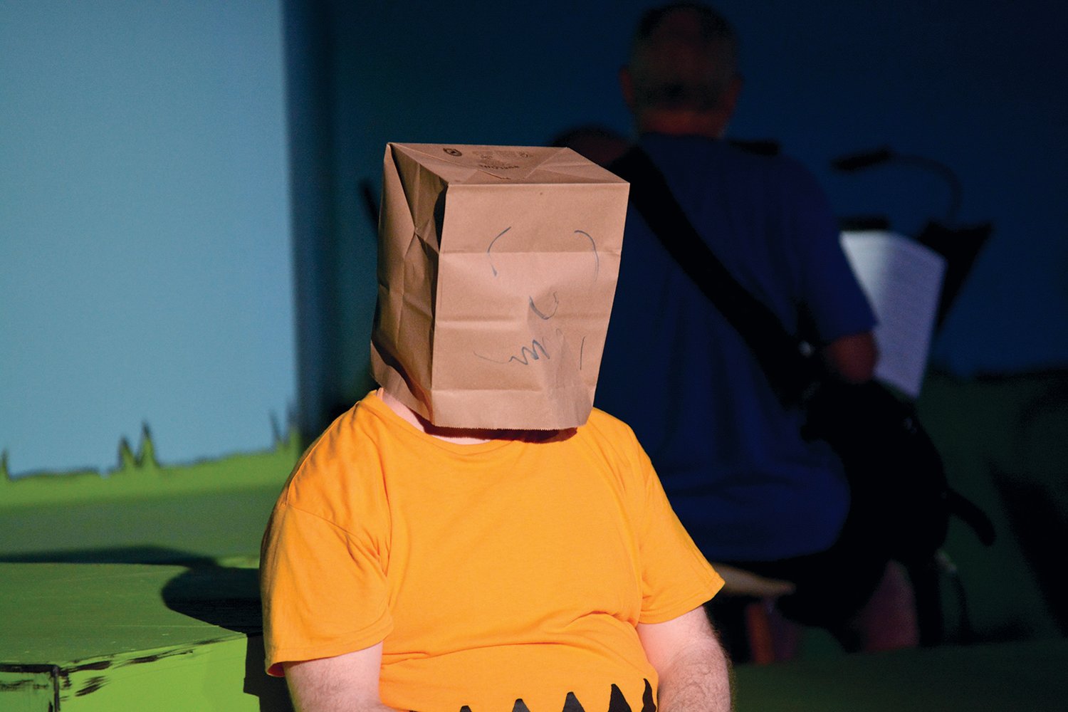 Charlie Brown wears a brown paper bag over his head, after another embarassing attempt to talk to the “cute girl at lunch.”