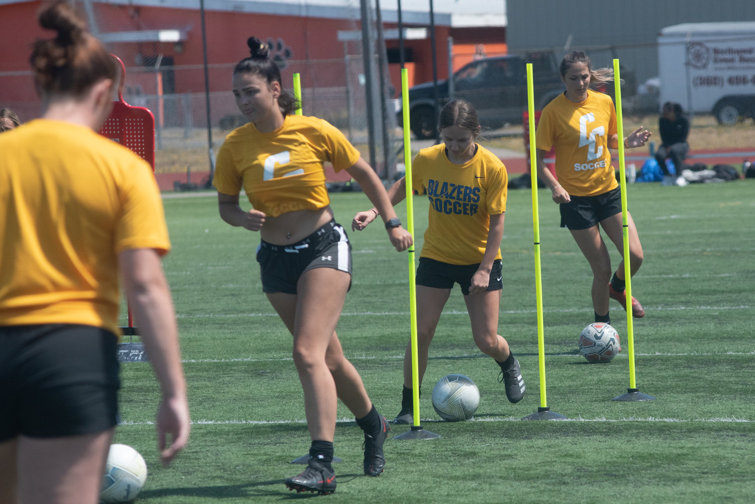 A trio of Trailblazers swerve through a drill during Centralia's practice on Aug. 3, 2022 at Centralia Tiger Stadium.