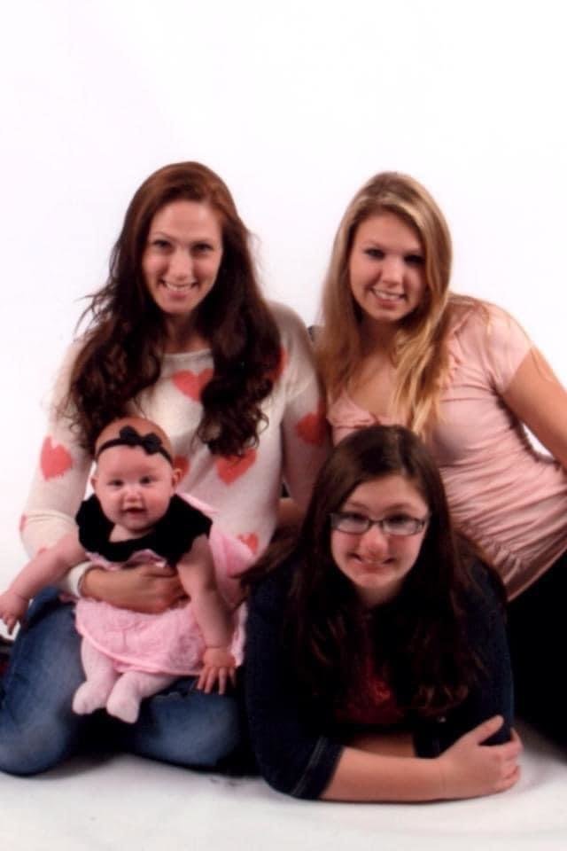 Joanna Rieke (top left), her daughter Kaitlyn, granddaughter Bryn (baby) and daughter Hailey.