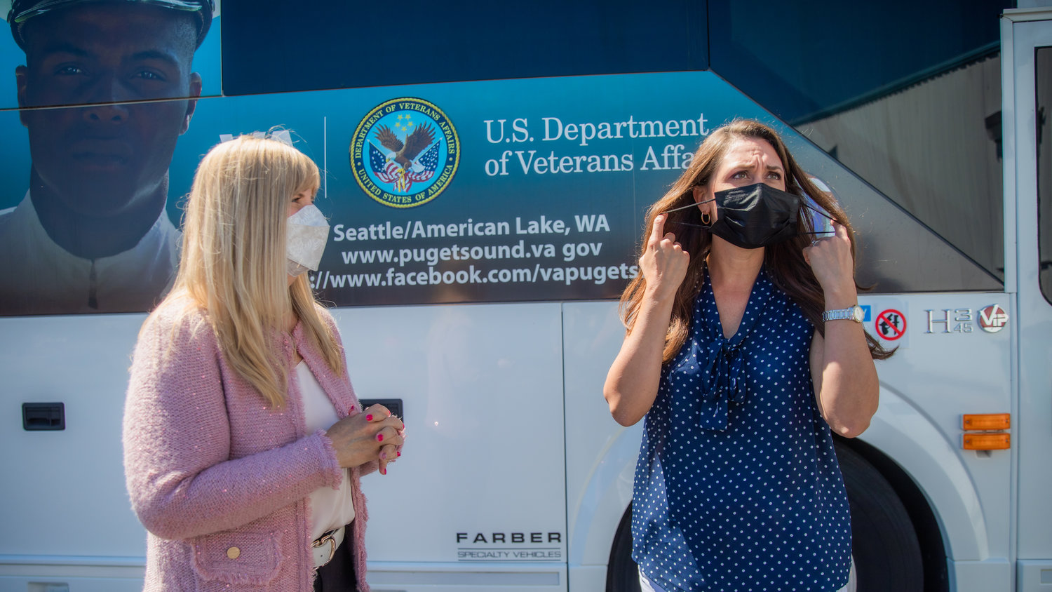 U.S. Congresswoman Jaime Herrera Beutler, right, removes her mask after stepping out of a Mobile Medical Unit alongside Executive Vice President Deborah Archer, with the Veterans Affairs Medical Center, Wednesday in Chehalis.