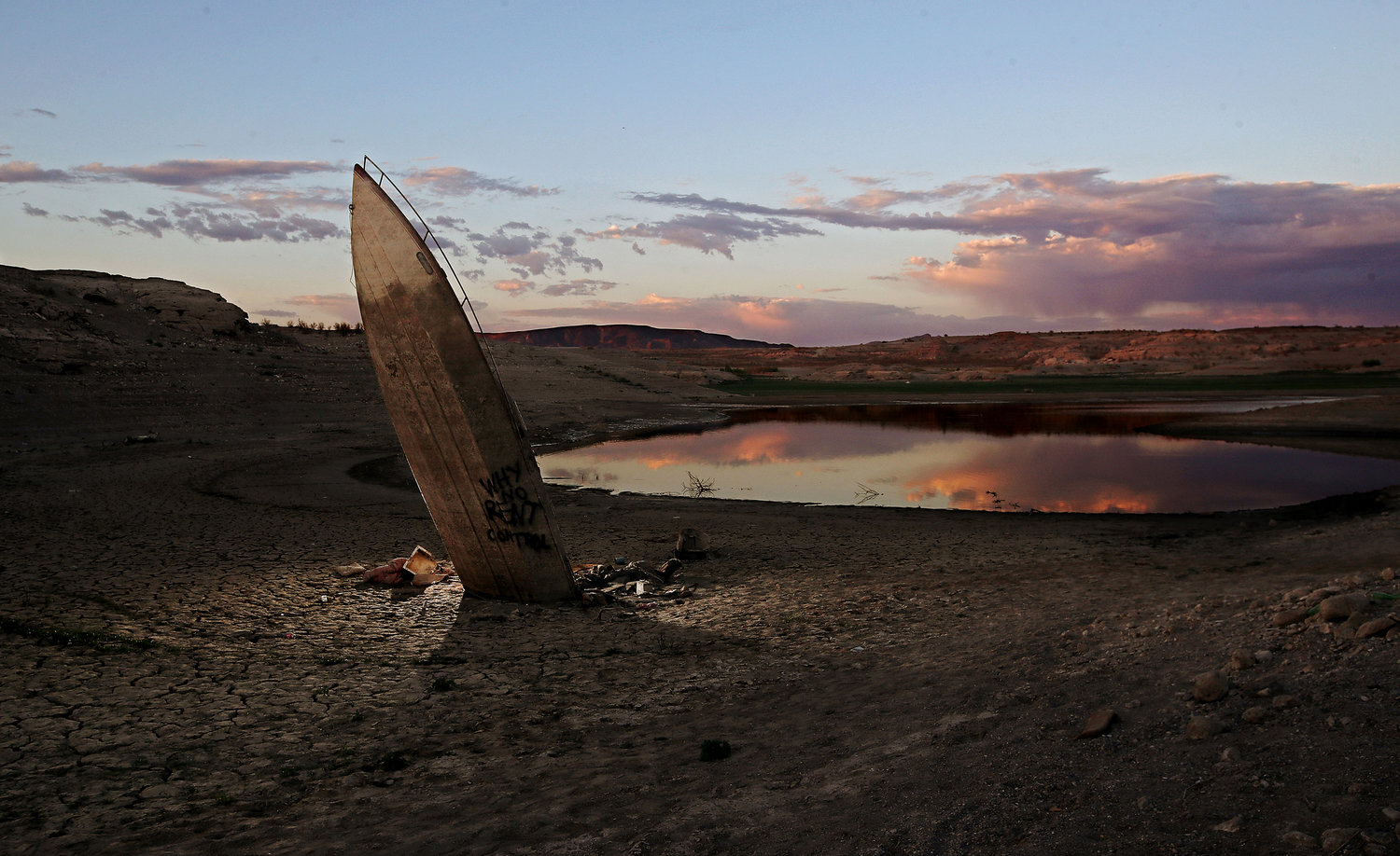 A boat that sank in Lake Mead resurfaces as water continues to recede in the nation's largest reservoir. Four sets of human remains have been found in recent months. (Luis Sinco/Los Angeles Times/TNS)
