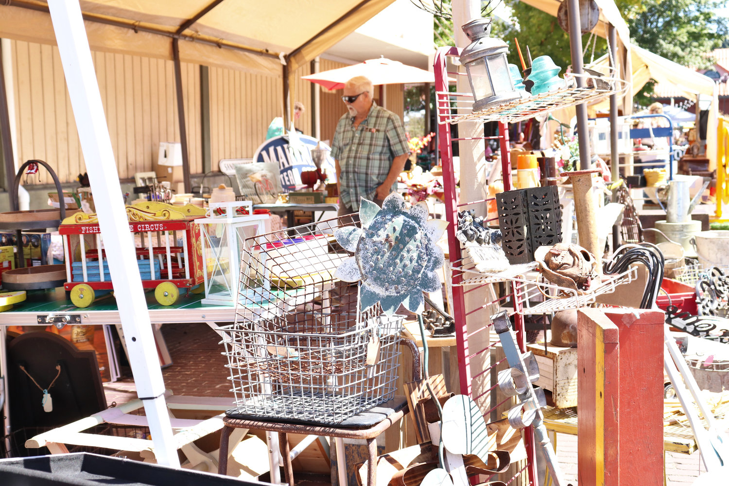 Customers browse a variety of antique, vintage and recycled goods at Antique Fest in downtown Centralia on Sunday.