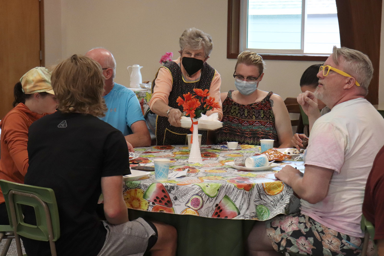 Volunteers mingle with cyclists at Chehalis United Methodist Church on Wednesday.