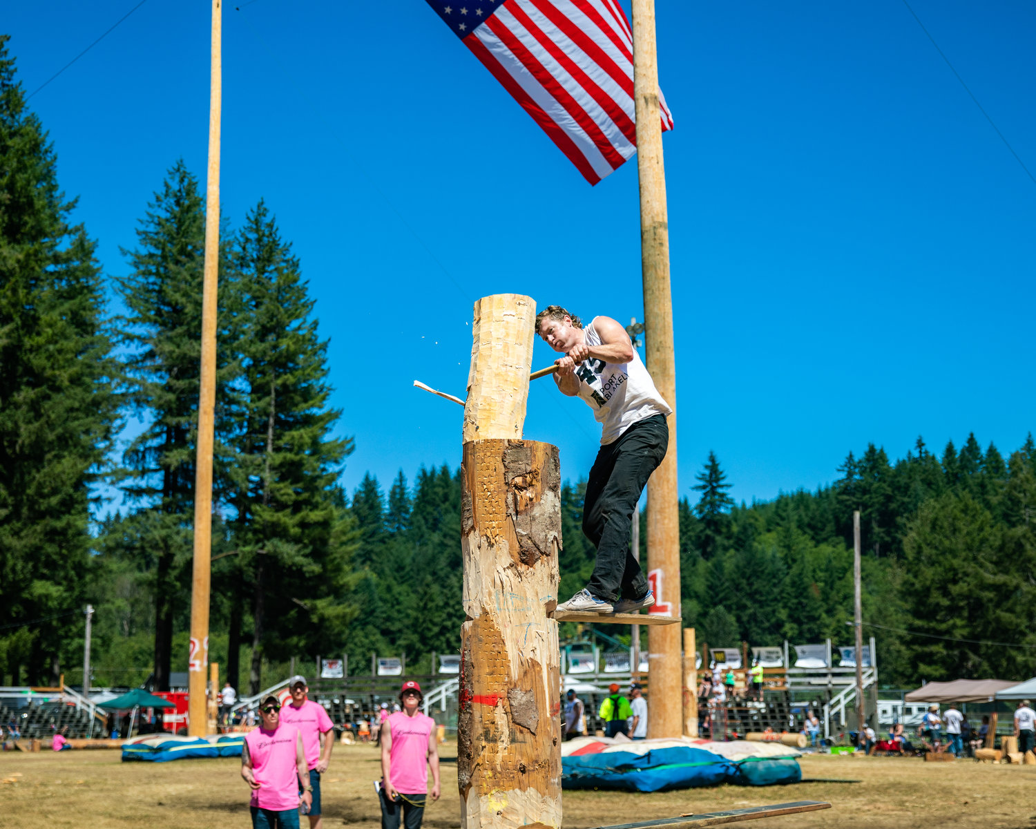 Cassidy Scheer works to split a log while standing atop a spring board during the Morton Loggers’ Jubilee on Sunday afternoon in Morton.