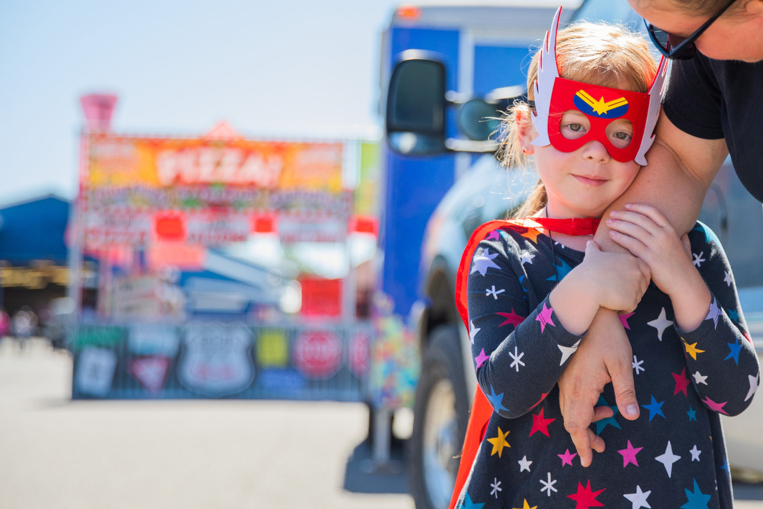Harper Foro, 5, sports a superhero mask and cape at the Southwest Washington Fairgrounds in Centralia.