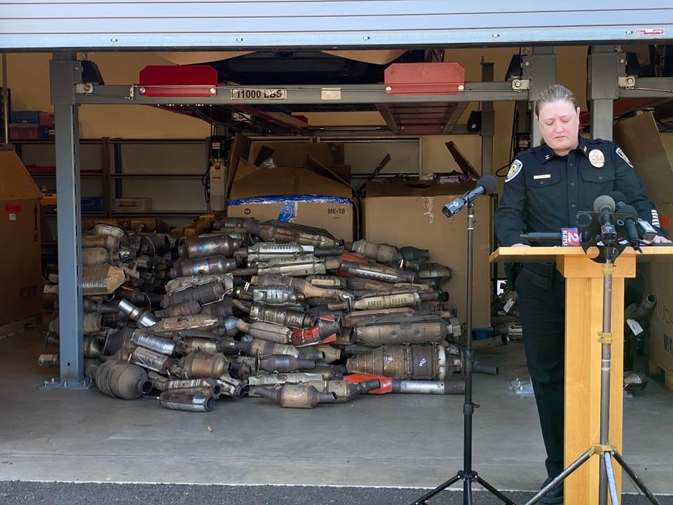 Beaverton Police Department's interim chief Stacy Jepson speaks in front of about 1,000 catalytic converters, which were taken for evidence after a months-long investigation brought down a local organized crime ring that allegedly raked in millions of dollars stealing converters up and down the West Coast.