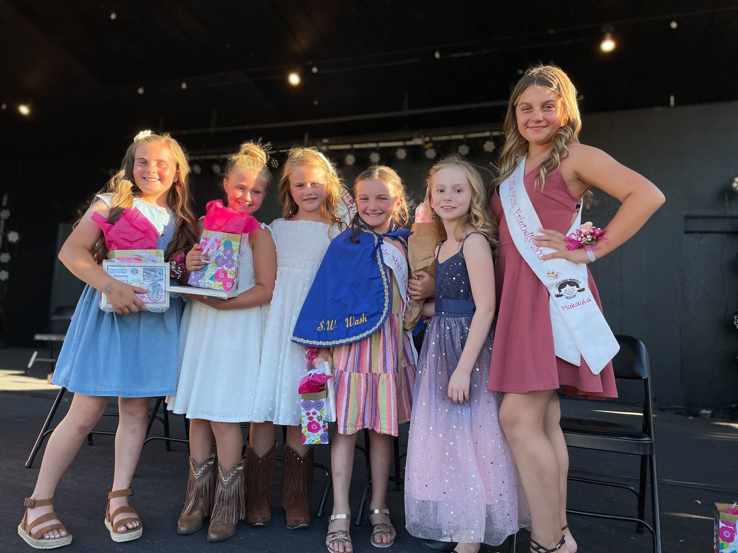 Emma Britton, a 9-year-old from Chehalis who attends Orin Smith Elementary School, has been named Little Miss Friendly at the SW Washington Fair. Emma comes from a friendly family: Her grandmother held the title many years ago. She’s the one at center wearing the iconic cape.
