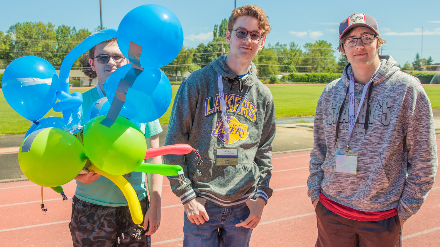 Wyatt Peek, of Toledo, Bailey Davis, of Adna and Canon Rupert of Chehalis pose for a photo with their project Tuesday afternoon at Bearcat Stadium.
