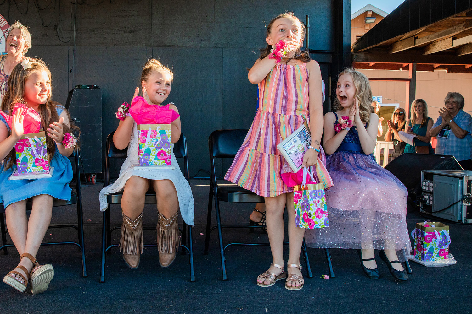 Emma Britton reacts to being named Little Miss Friendly Tuesday afternoon on the Saloon Stage at the Southwest Washington Fairgrounds in Centralia.