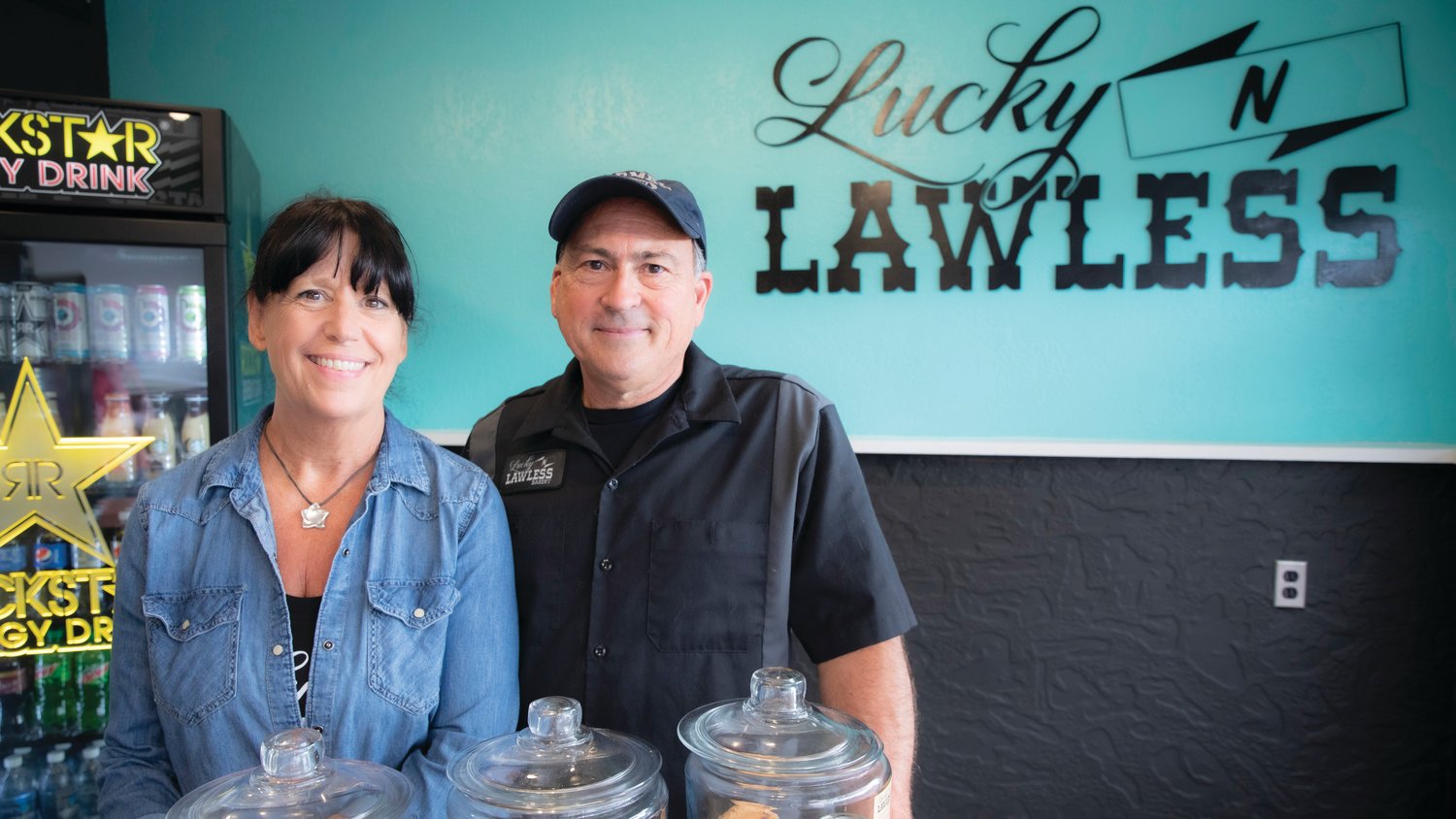 Pam and Steven Kaiser smile for a photo inside the Lucky 'N Lawless Bakery Friday afternoon in Centralia.