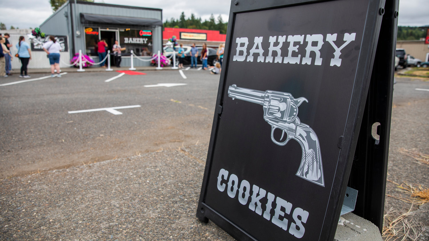 Signage for bakery cookies sits on display outside Lucky 'N Lawless in Centralia on Friday.