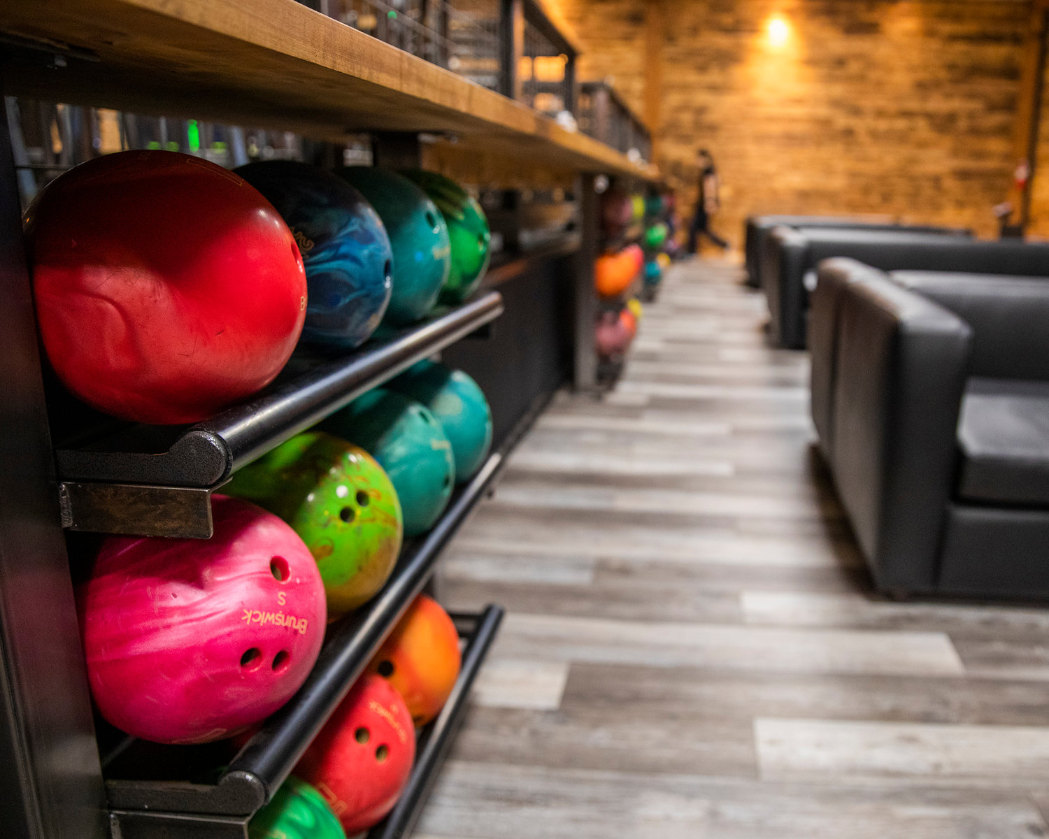 Bowling balls fill shelves at Mill Town Smokehouse in Morton.