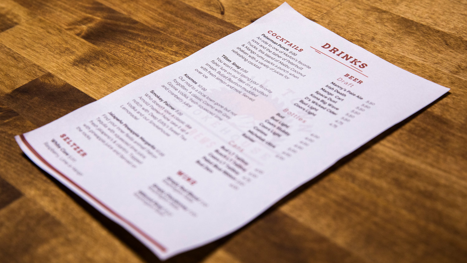 A drink menu sits on a table at Mill Town Smokehouse in Morton.