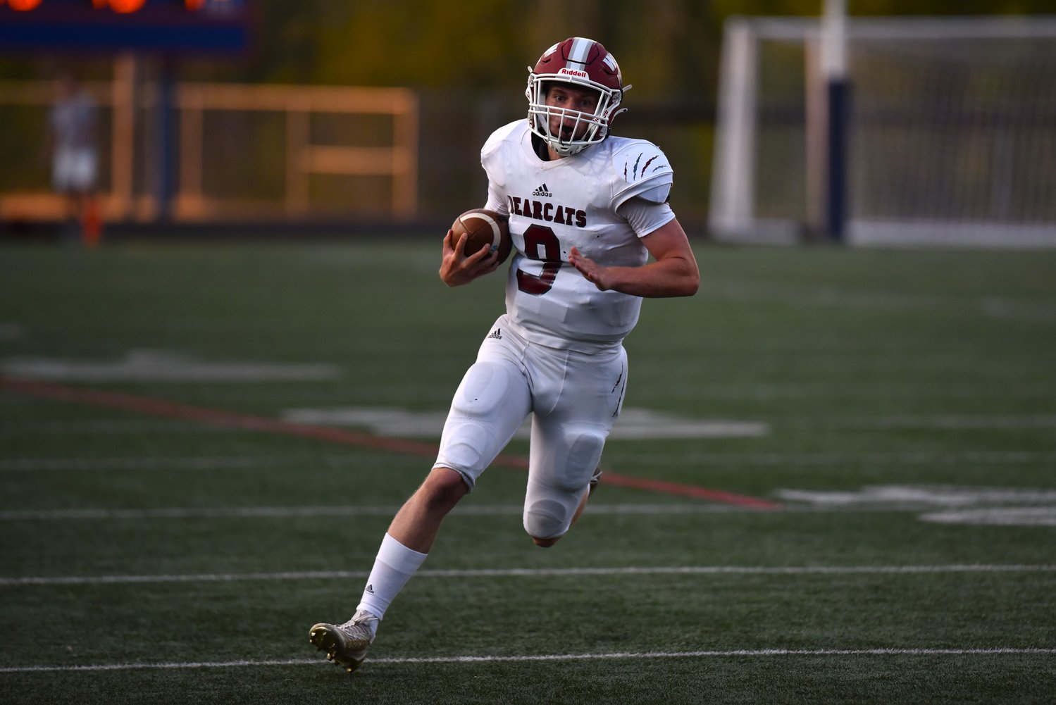W.F. West quarterback Gavin Fugate turns the corner on a 46-yard touchdown run in the first quarter of the Bearcats' 38-28 win at Ridgefield on Sept. 3.