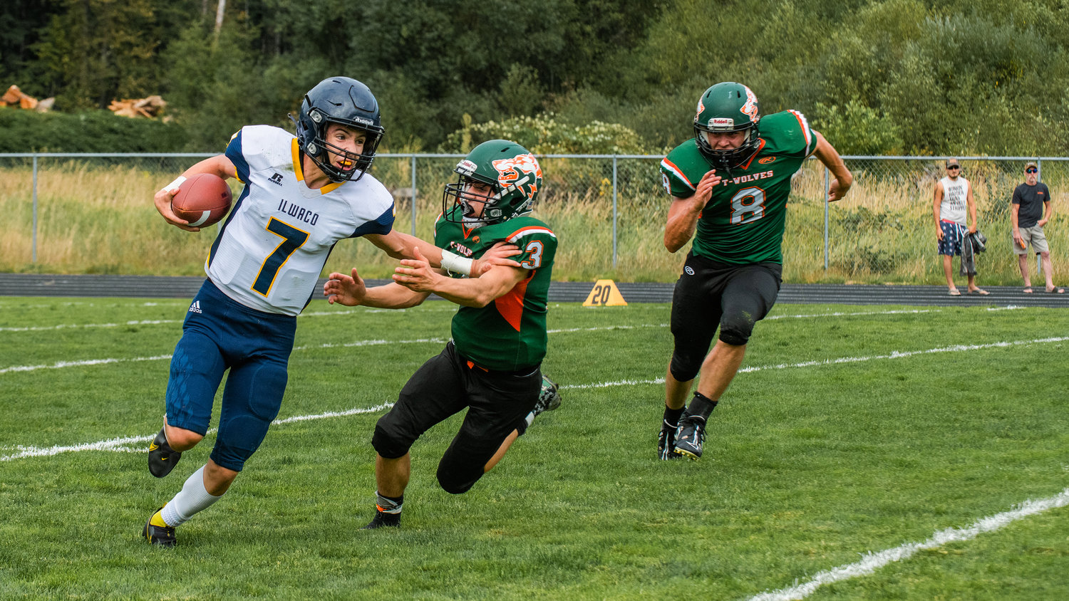 Timberwolves swarm Ilwaco’s Kyle Morris (7) before bringing him down for a sack Saturday afternoon in Morton.