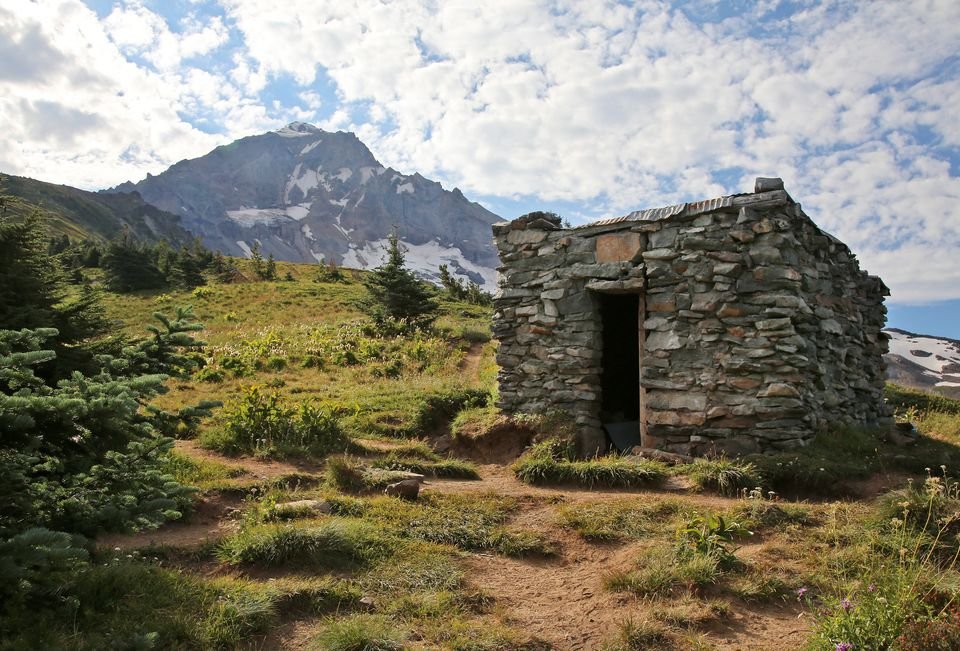 The McNeil Point Shelter, with the peak of Mount Hood just beyond, is the endpoint of the beautiful McNeil Point Hike on the northwest side of the mountain.