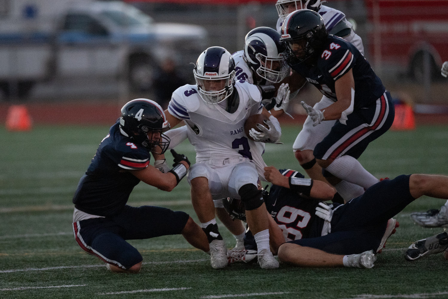 Xander Shepler (4) and Keegan Rongen (89) combine to bring down a North Thurston ballcarrier during Black Hills' 15-0 win over the Rams on Sept. 8 in Lacey.