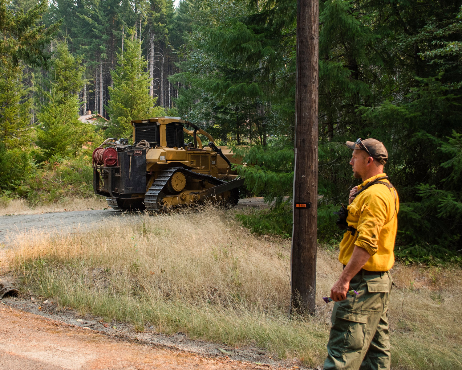 Bulldozers are driven through Timberline to create a buffer zone between forests and neighborhoods as the Goat Rocks Fire blaze on Saturday afternoon was about a mile from structures in the area.