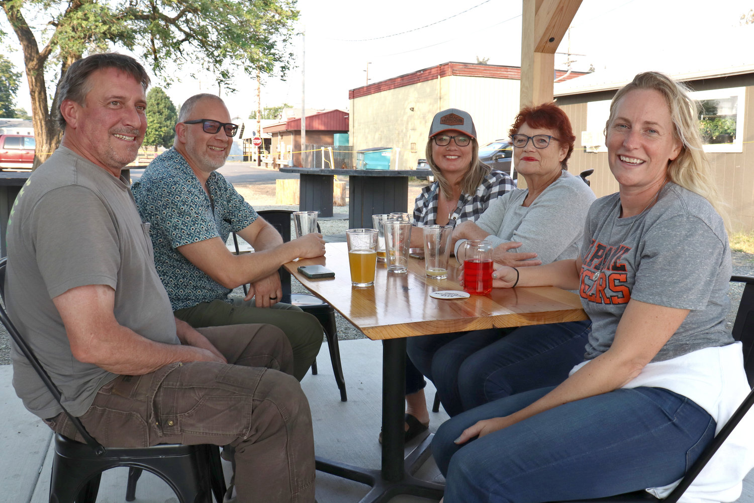 Tasha Landram and family pause for a photo amid drink and conversation at Tumac Taproom in Napavine on Friday.