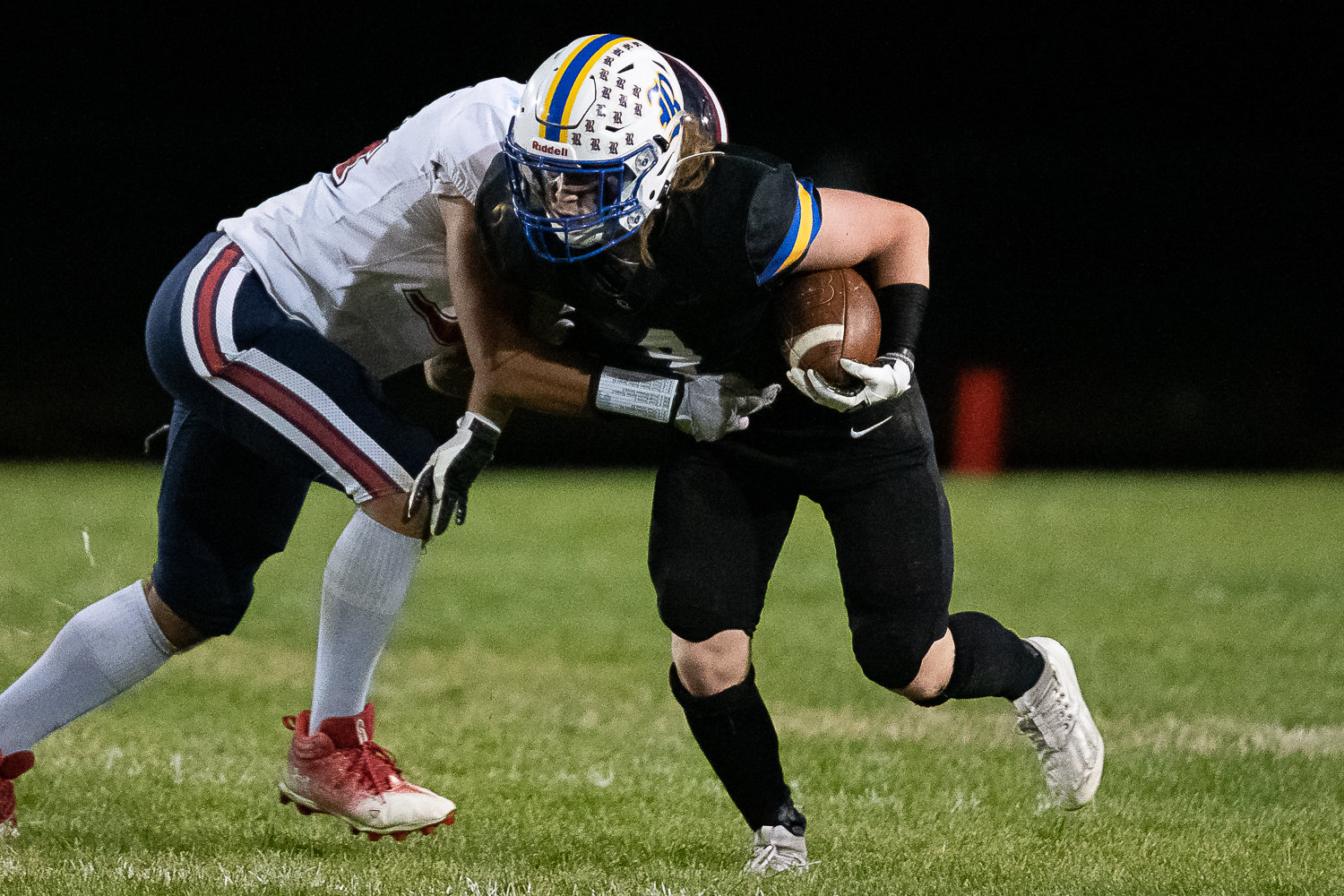 Rochester's Braden Hartley looks to break a tackle in a 34-14 loss to Black Hills Sept. 16.