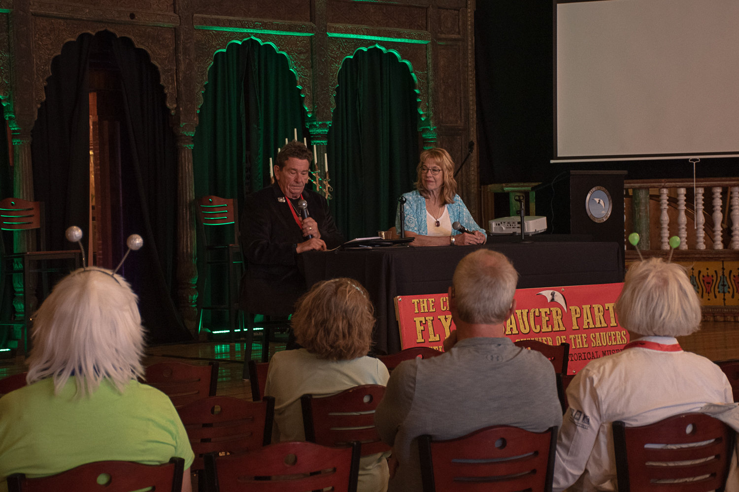James and Joanne Clarkson talk Chehalis Flying Saucer Party attendees through some of the eyewitness accounts of UFO encounters they have collected throughout their years of research. James is a retired detective while Joanne is a psychic medium. Photo by Owen Sexton.