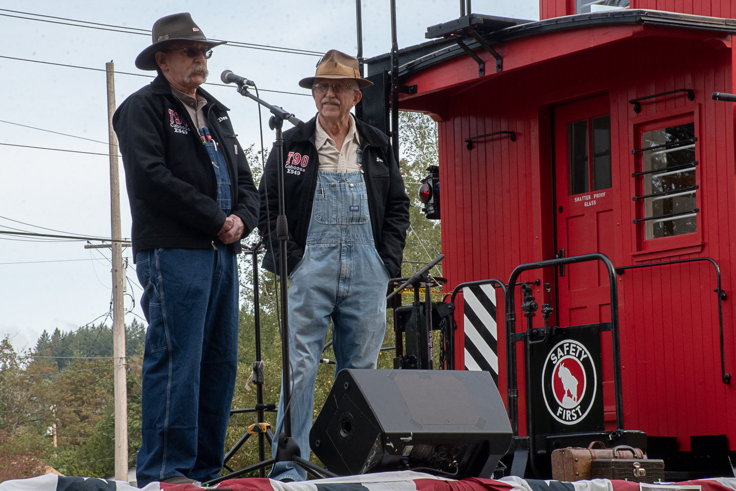 Don Bowman, left, and Jan Wigley, right, talk a crowd of around 100 locals from throughout the area through the restoration work they did over the past two years on the caboose for the Tenino Depot Museum. Photo by Owen Sexton.