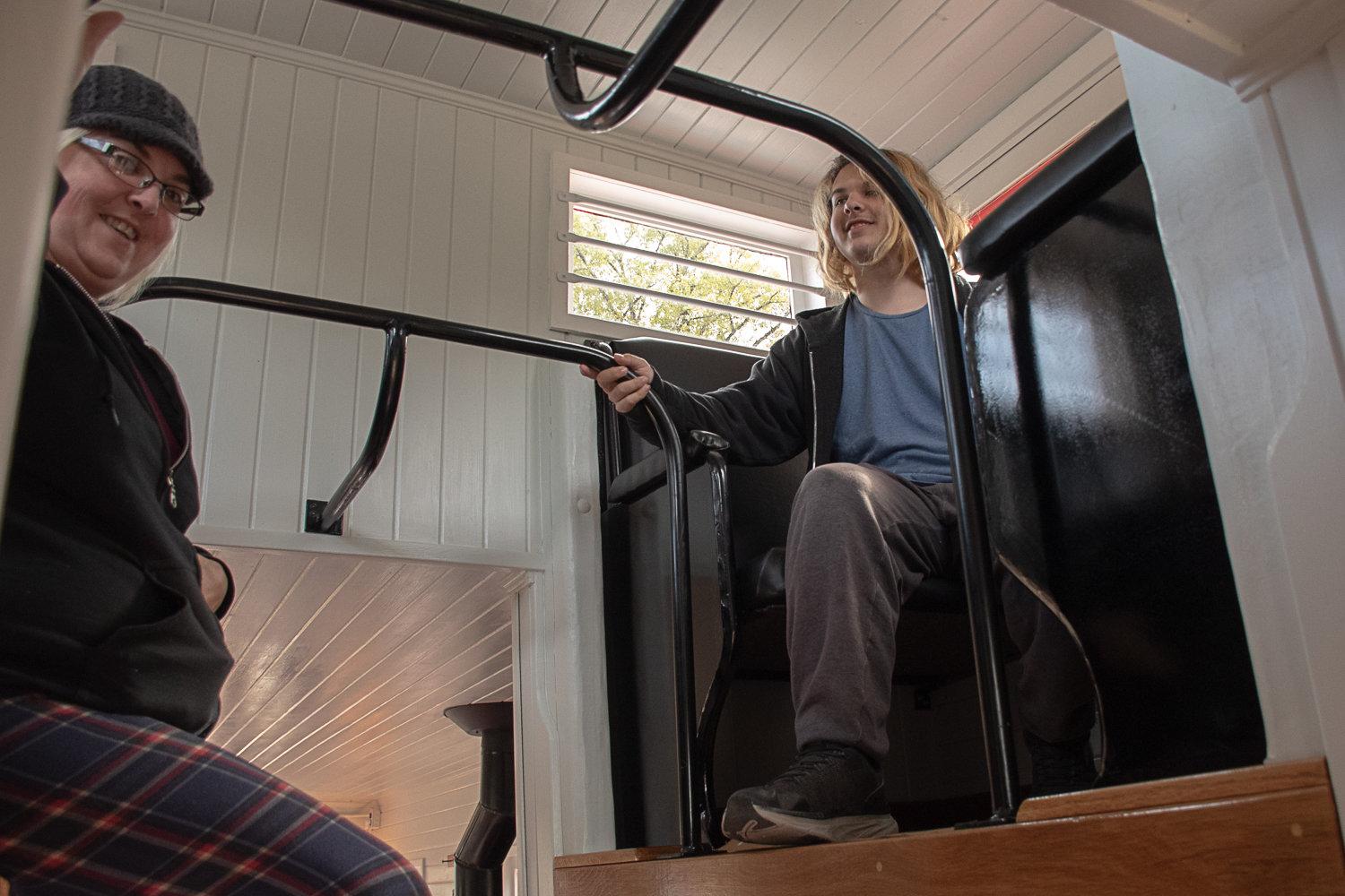 Samantha Burgess and her son Orion Connon explore the cupola on the newly restored caboose at the Tenino Depot Museum at the Tenino Railroad Day festival. Photo by Owen Sexton.