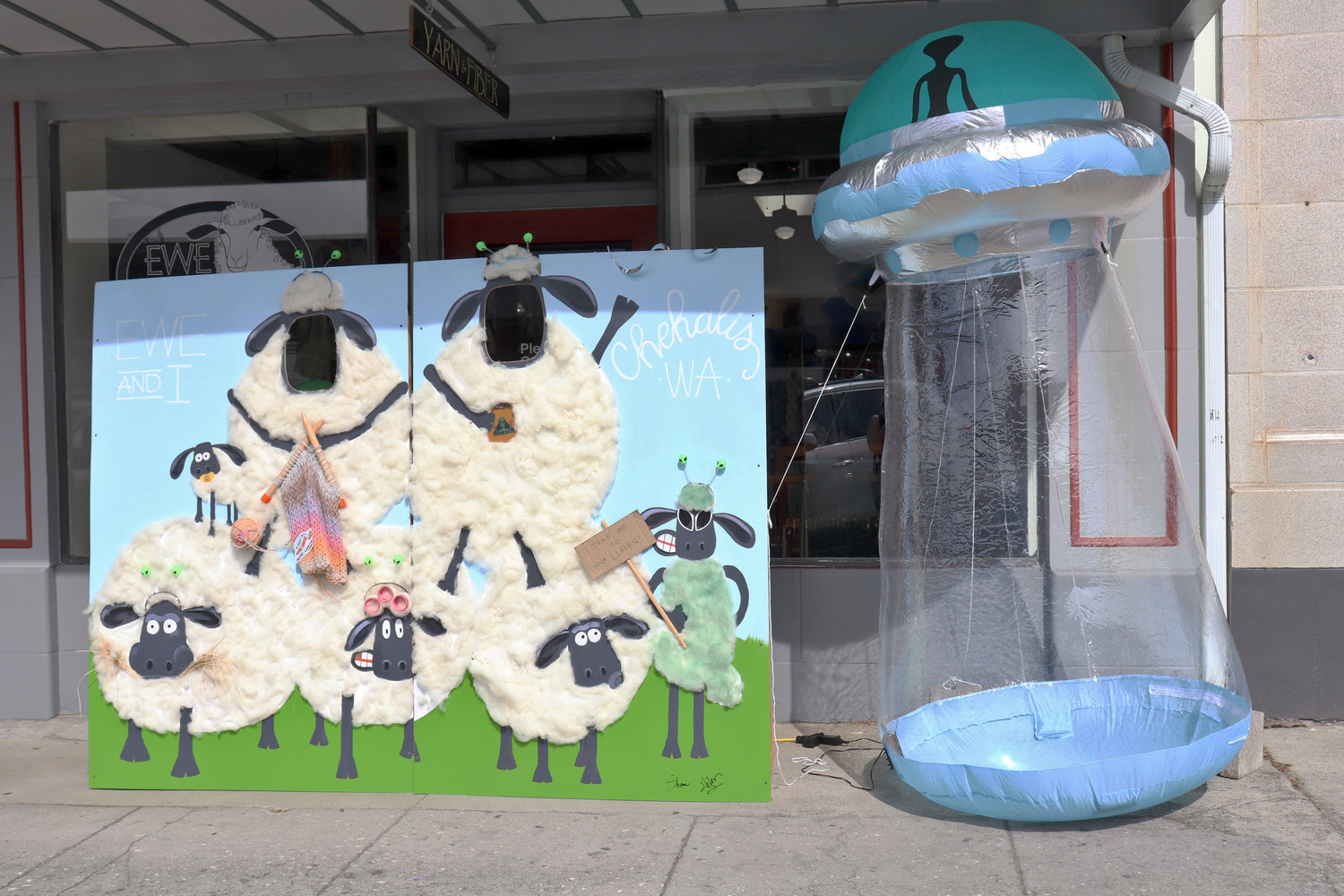 An alien-themed photo booth sits outside Ewe and I yarn store in Chehalis during the Chehalis Flying Saucer Party on Saturday.
