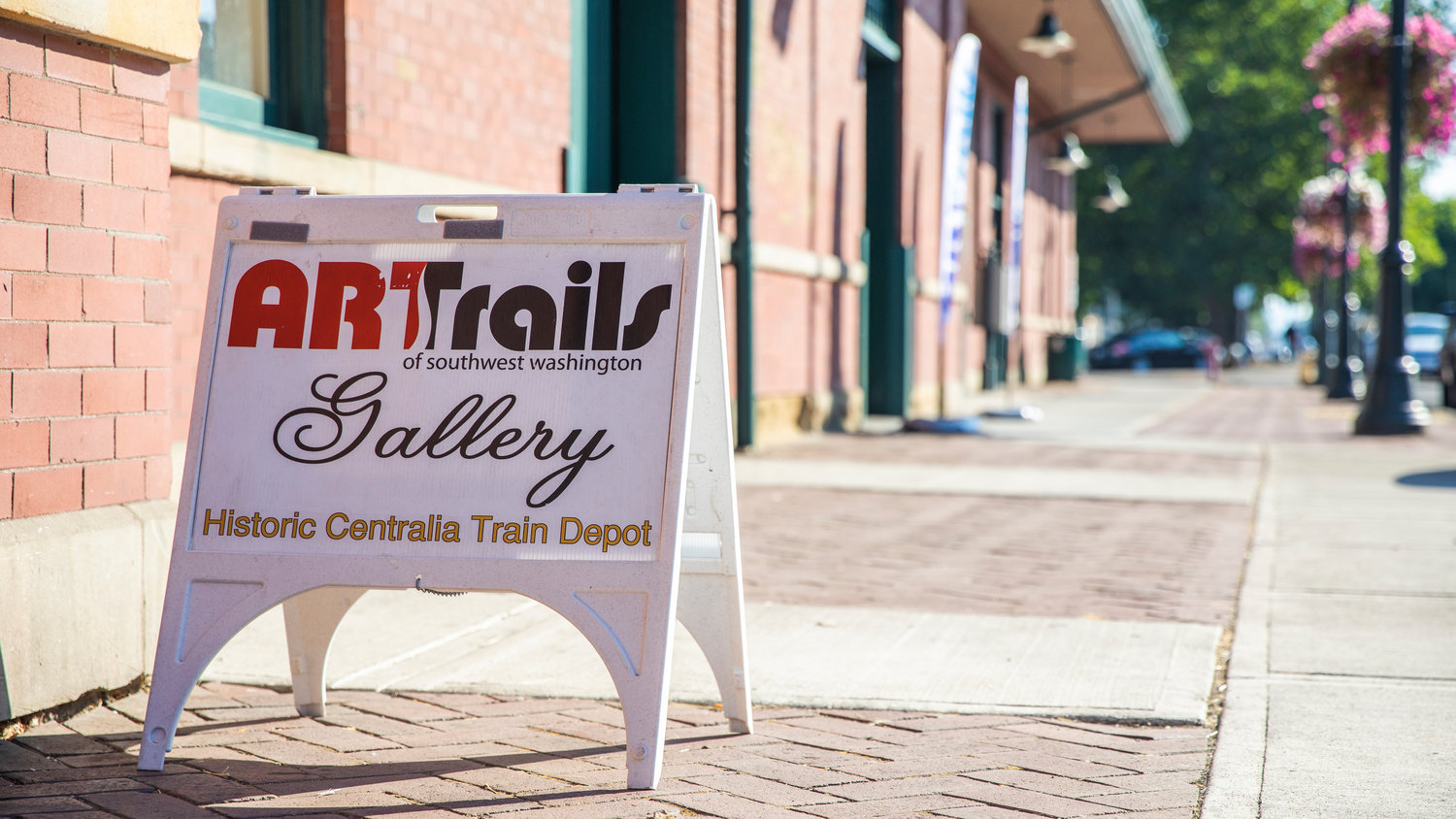 Signage for an ARTrails Gallery sits on display outside the Centralia Train Station on Tuesday.