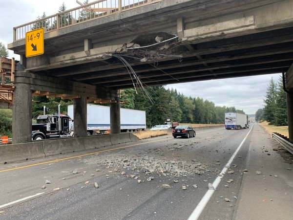 A logging truck struck the state Route 506 overpass on Interstate 5 on Thursday.