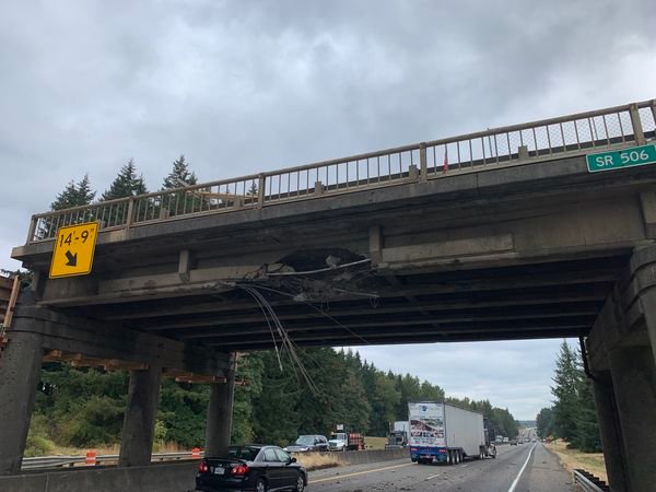 A logging truck struck the state Route 506 overpass on Interstate 5 on Thursday.