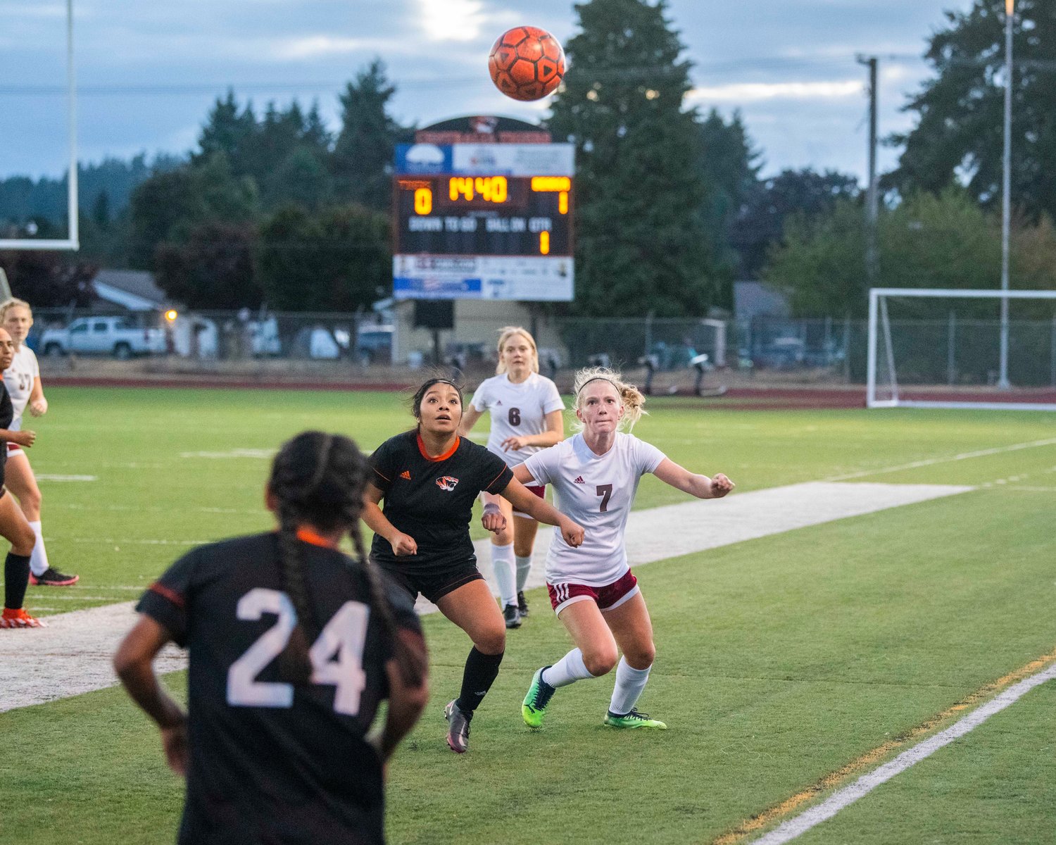 Tigers and Bearcats fight for possession of the ball on a throw in Thursday in Centralia.