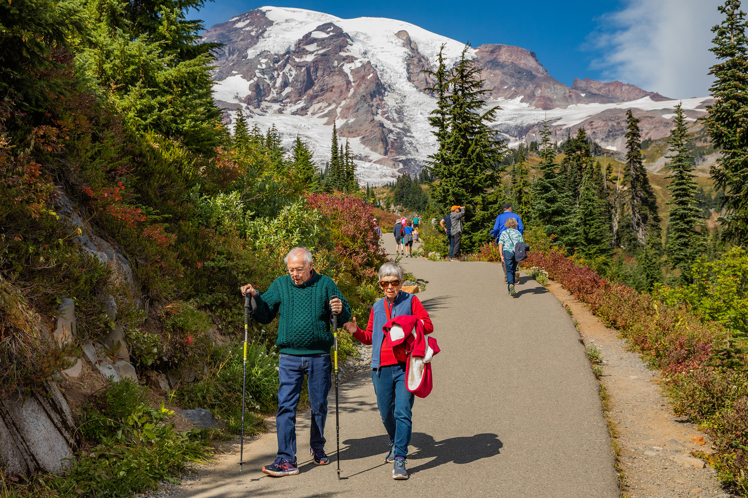 Visitors take in views of Mount Rainier while walking along paths through Paradise on Wednesday near Ashford.