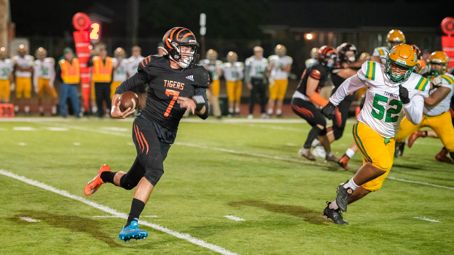 Centralia senior Tommy Billings (7) looks upfield with the football during a game against Tumwater Friday night.