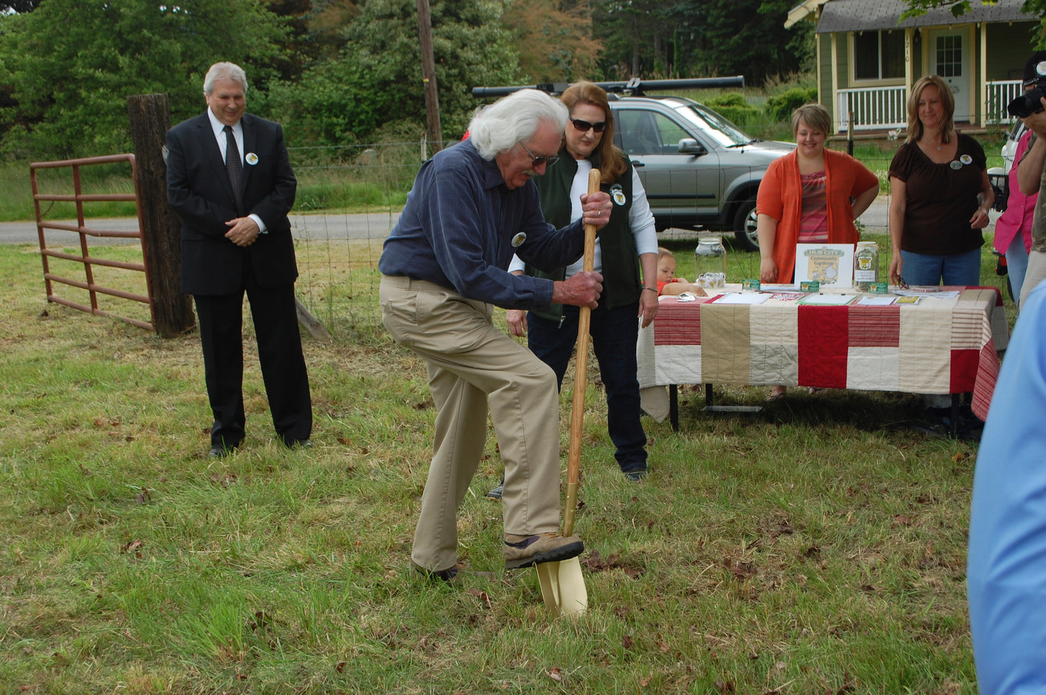 FILE PHOTO — Former mayor Bill Moeller digs the first shovel into the Hub City Community Garden  in this Chronicle file photo.