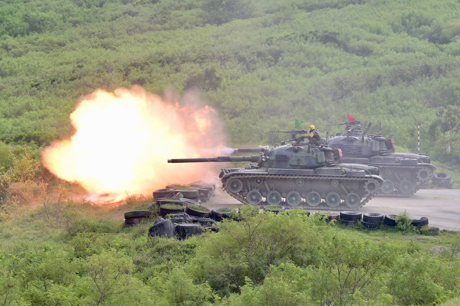 CM-11 tanks fire their cannons during a live-fire military exercise in Pingtung county, southern Taiwan, on Sept. 7, 2022. (Sam Yeh/AFP/Getty Images/TNS)