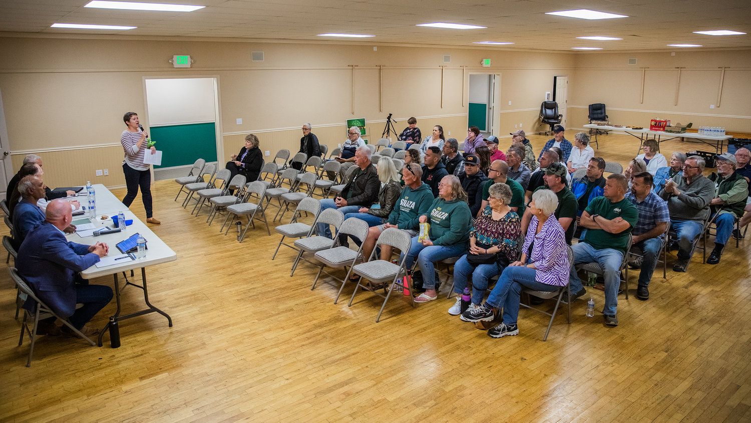 Mindy Brooks introduces candidates for attendees at Packwood Community Hall on Thursday.