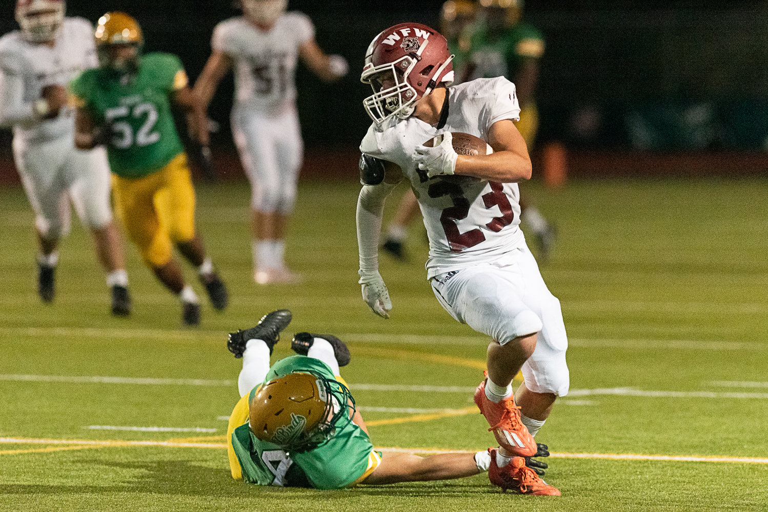 Evan Stajduhar evades a would-be tackler during the second quarter of W.F. West's 28-7 win over Tumwater on Sept. 30.