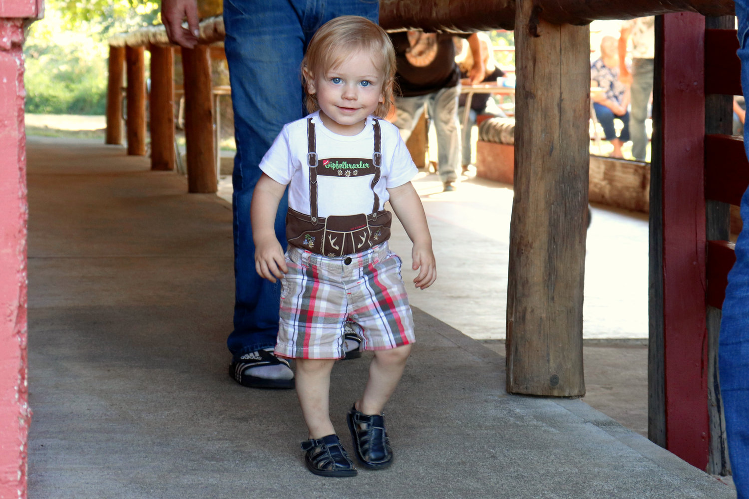 Sixteen-month-old James sports a T-shirt version of lederhosen during the Lewis-Pacific Swiss Society Oktoberfest in Frances on Saturday.