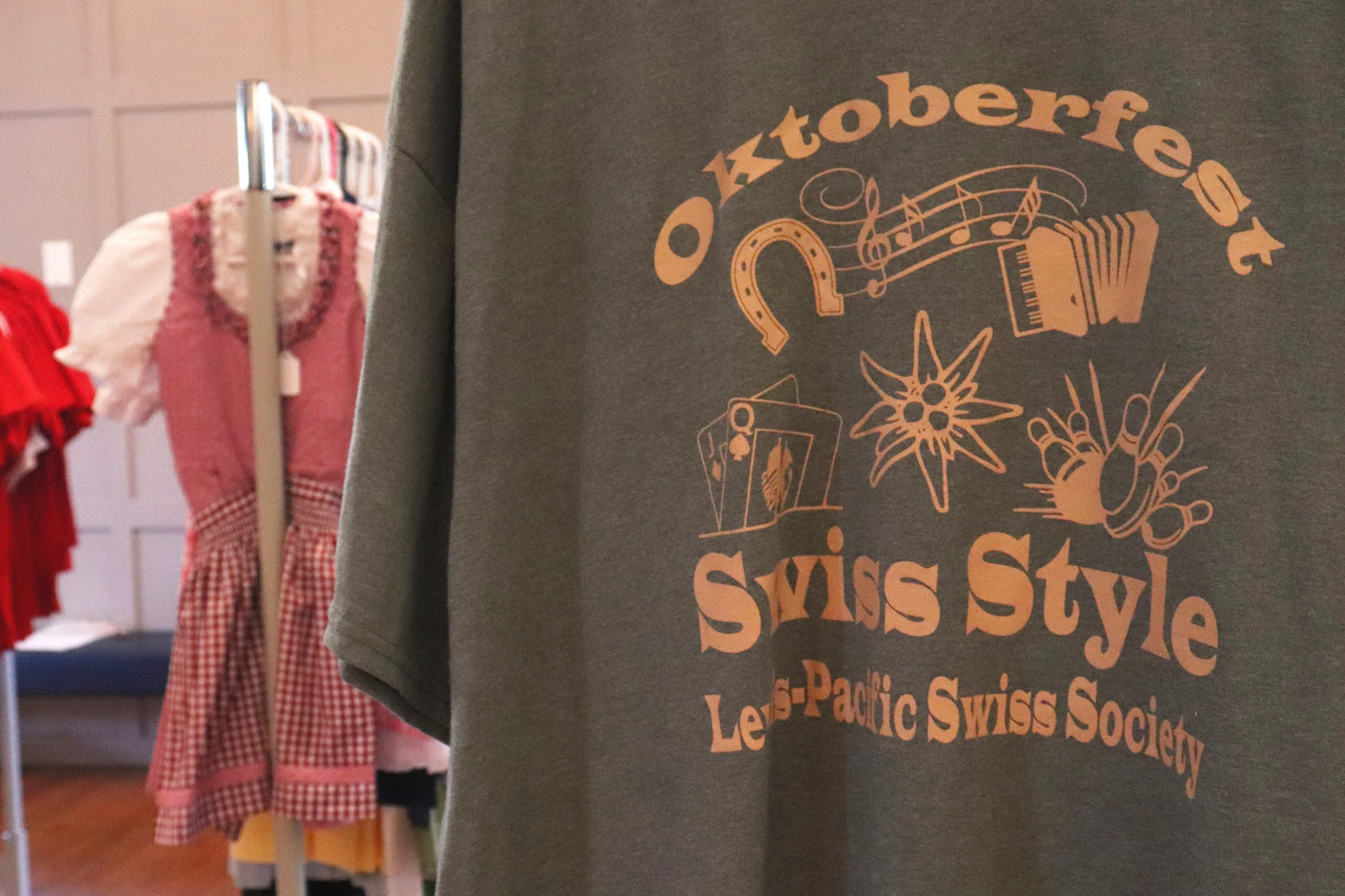 An official Lewis-Pacific Swiss Society Oktoberfest shirt hangs on display in Swiss Hall on Saturday.