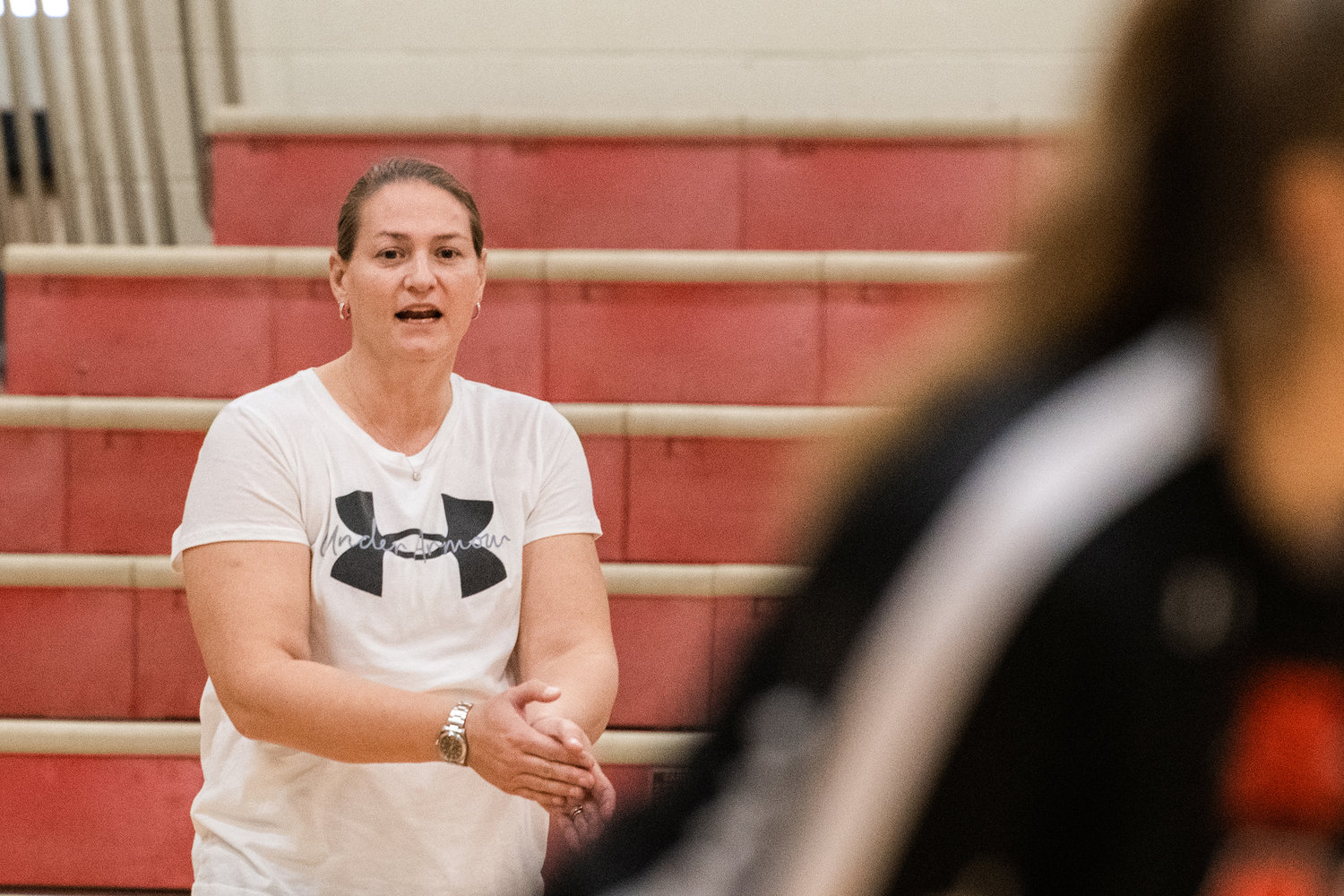 Rainier Head Coach Carrie Owens talks to players on the court during a game against Toledo on Tuesday.