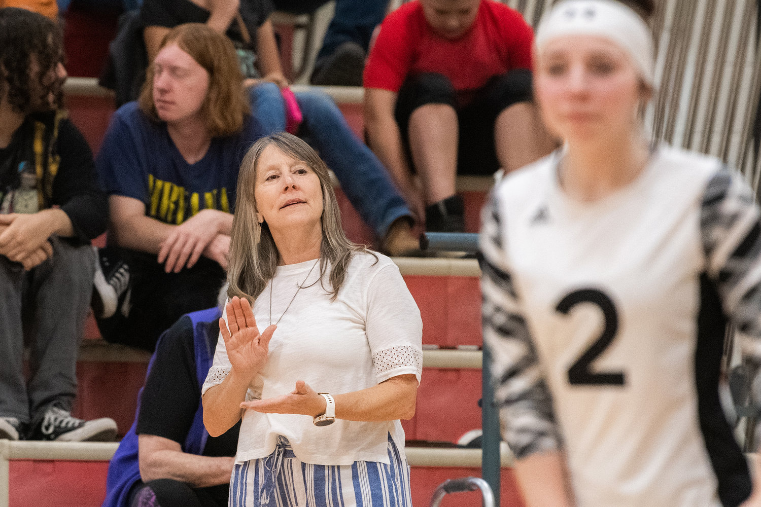 Toledo Head Coach Kelli Larson claps for players on the court during a game against Rainier on Tuesday.