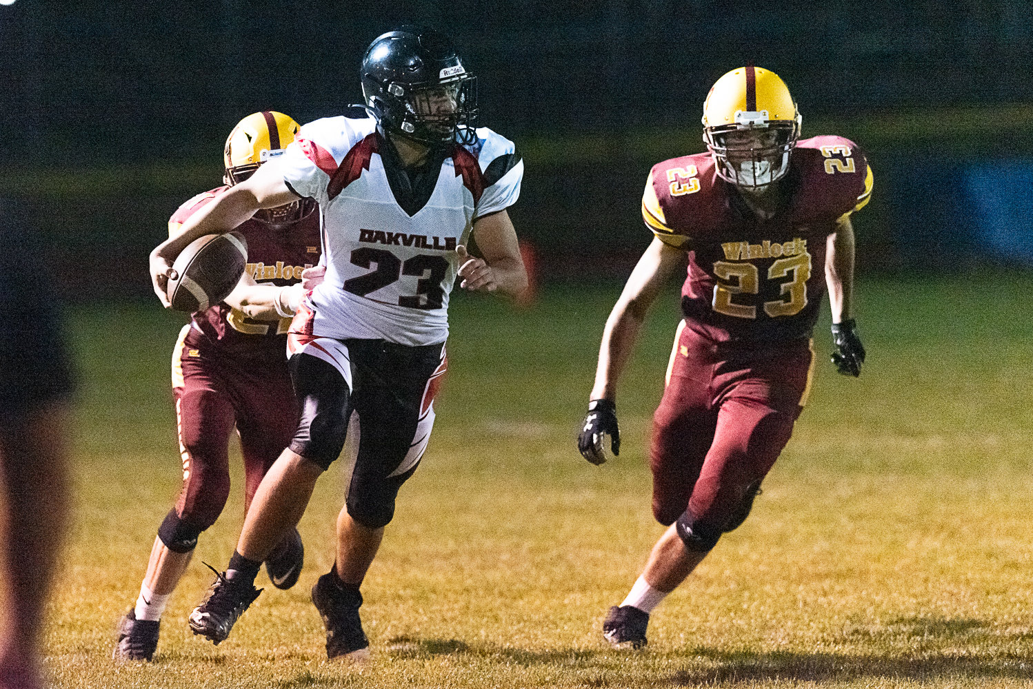 Oakville's Ashton Boyd goes upfield after a catch during the Acorns' 36-28 loss to Winlock on Oct. 7.