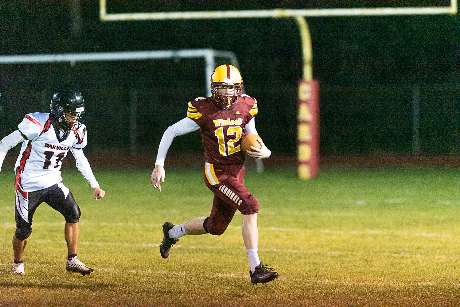 Chase Scofield carries the ball for Winlock in the Cardinals' 36-28 win over Oakville on Oct. 7.