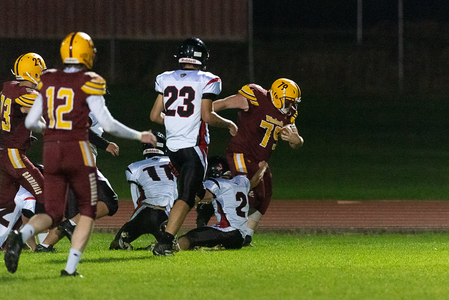 Winlock offensive lineman Austin Allen leaves a trail of Oakville defenders in his wake on a 17-yard rumble in the first half of the Cardinals' 36-28 win over the Acorns on Oct. 7.