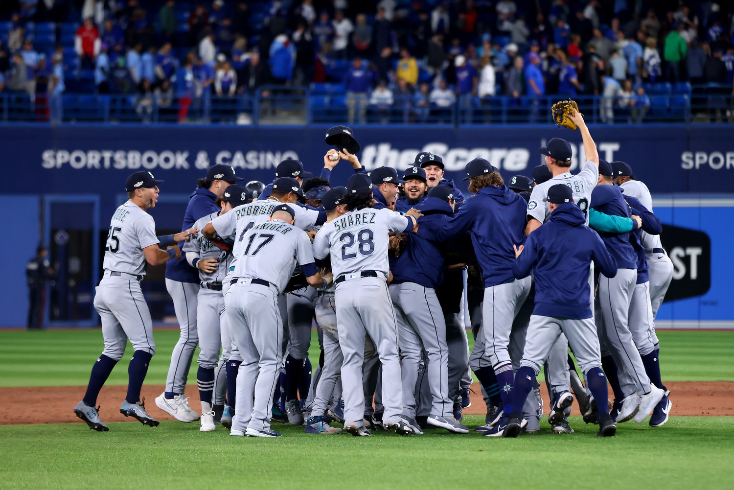 The Seattle Mariners celebrate after defeating the Toronto Blue Jays, 10-9, in Game 2 to win the American League Wild Card Series at Rogers Centre on Oct. 8, 2022, in Toronto. (Vaughn Ridley/Getty Images/TNS)