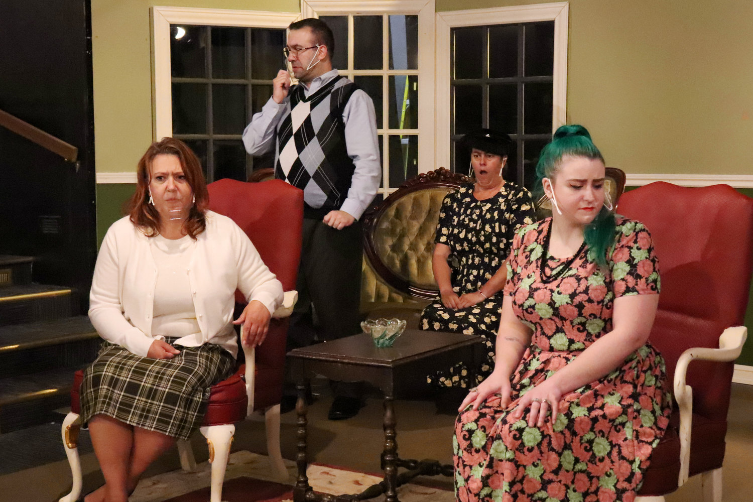 From left, Michelle Koenen as Letitia Blacklock, Tim Donnell as Edward Swettenham, Nichole Galyean as Mrs. Swettenham and Brittany Wilcox as Phillipa Haymes perform on stage during a rehearsal of “A Murder is Announced” at Evergreen Playhouse last week.