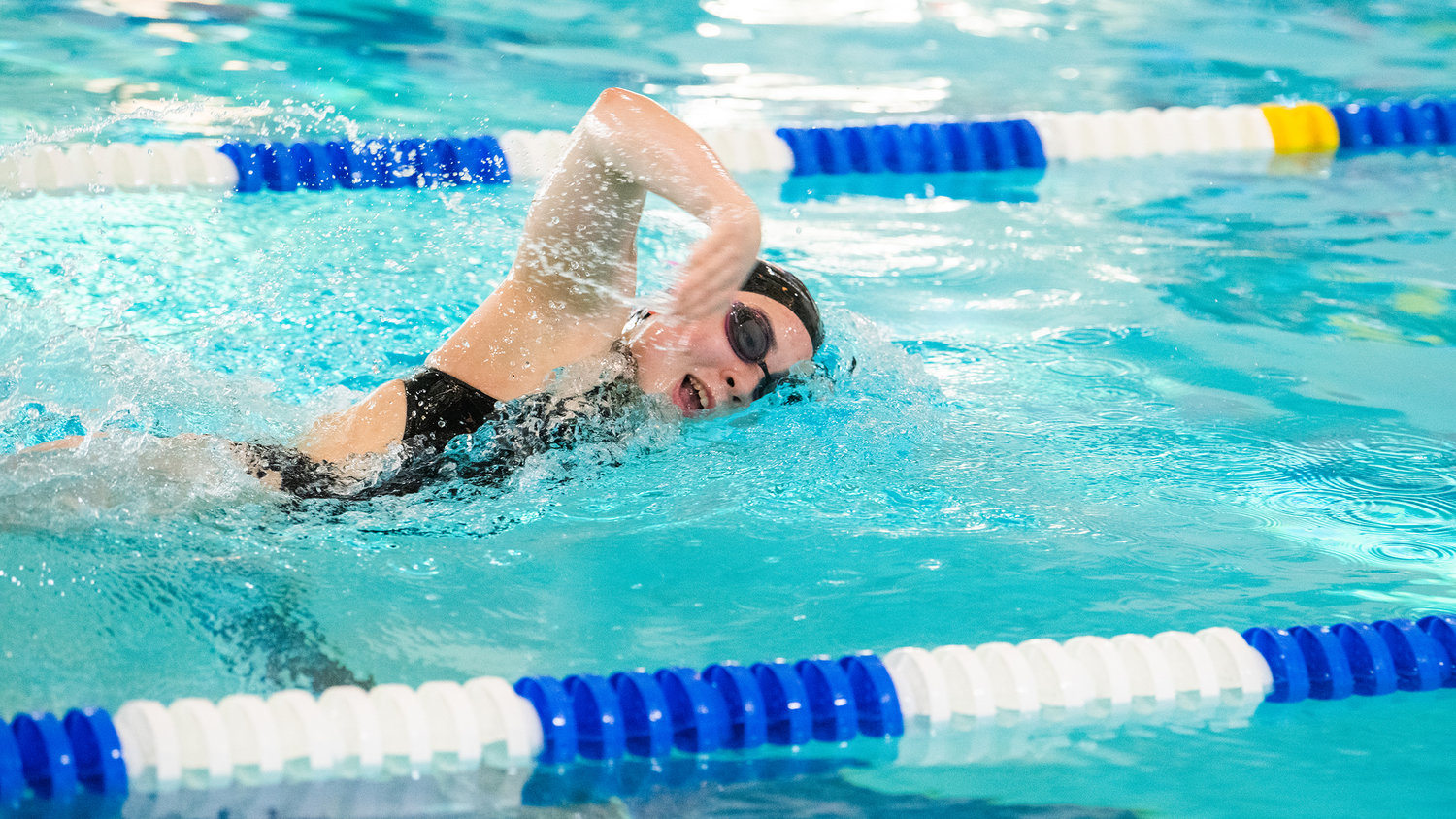 Centralia senior Chihiro Bringman breathes between strokes during the last home swim meet of the season Thursday afternoon at Thorbeckes in Centralia.