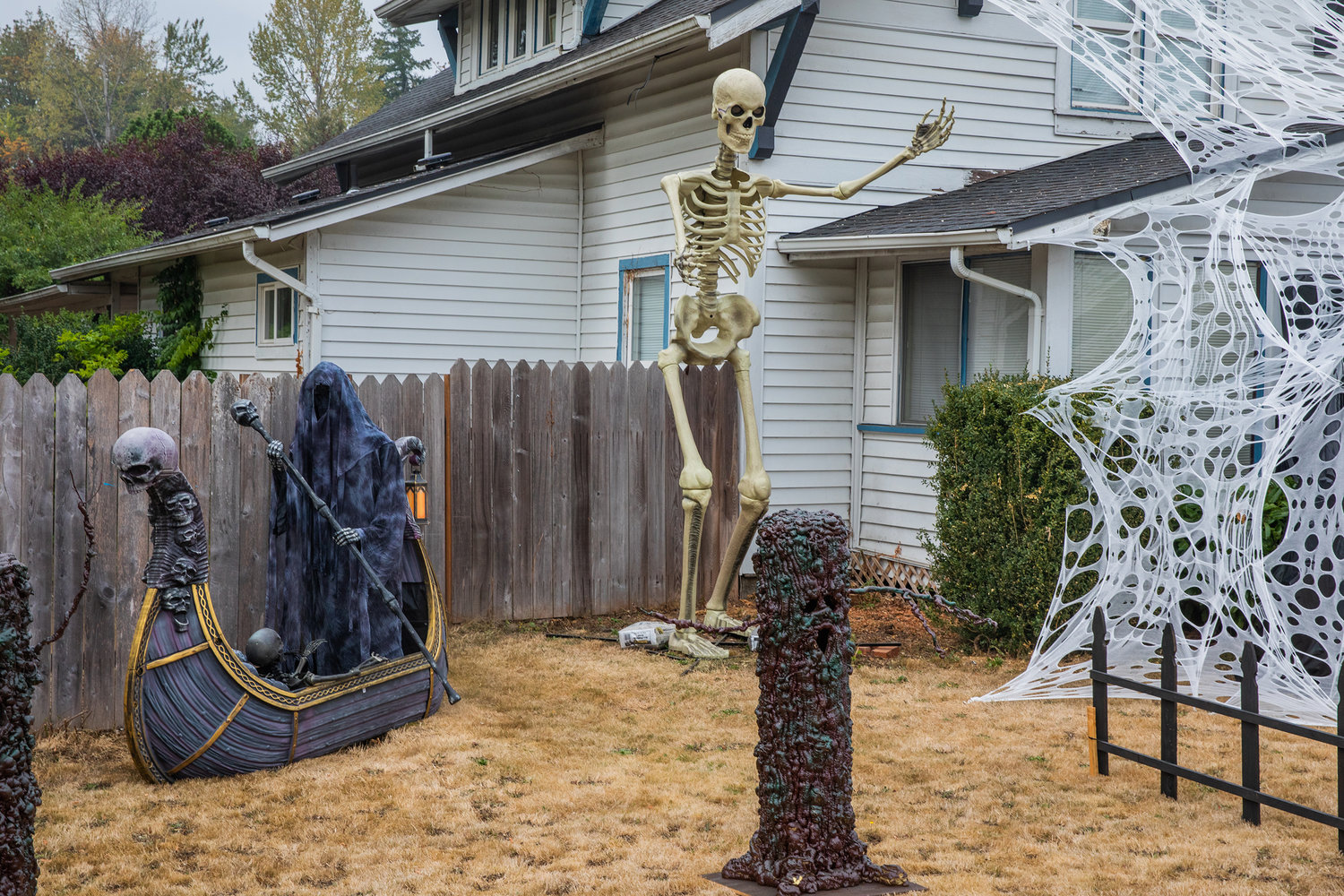 A skeleton stands at roughly twelve feet tall in the 400 block of state Route 505 in Toledo on Thursday.