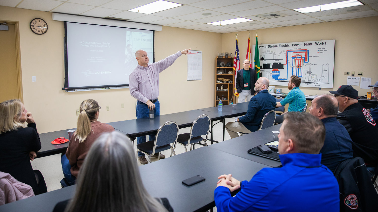 Vice President of TransAlta Centralia Generation Mickey Dreher talks about sections of the power plant Tuesday morning during a meeting with local representatives.